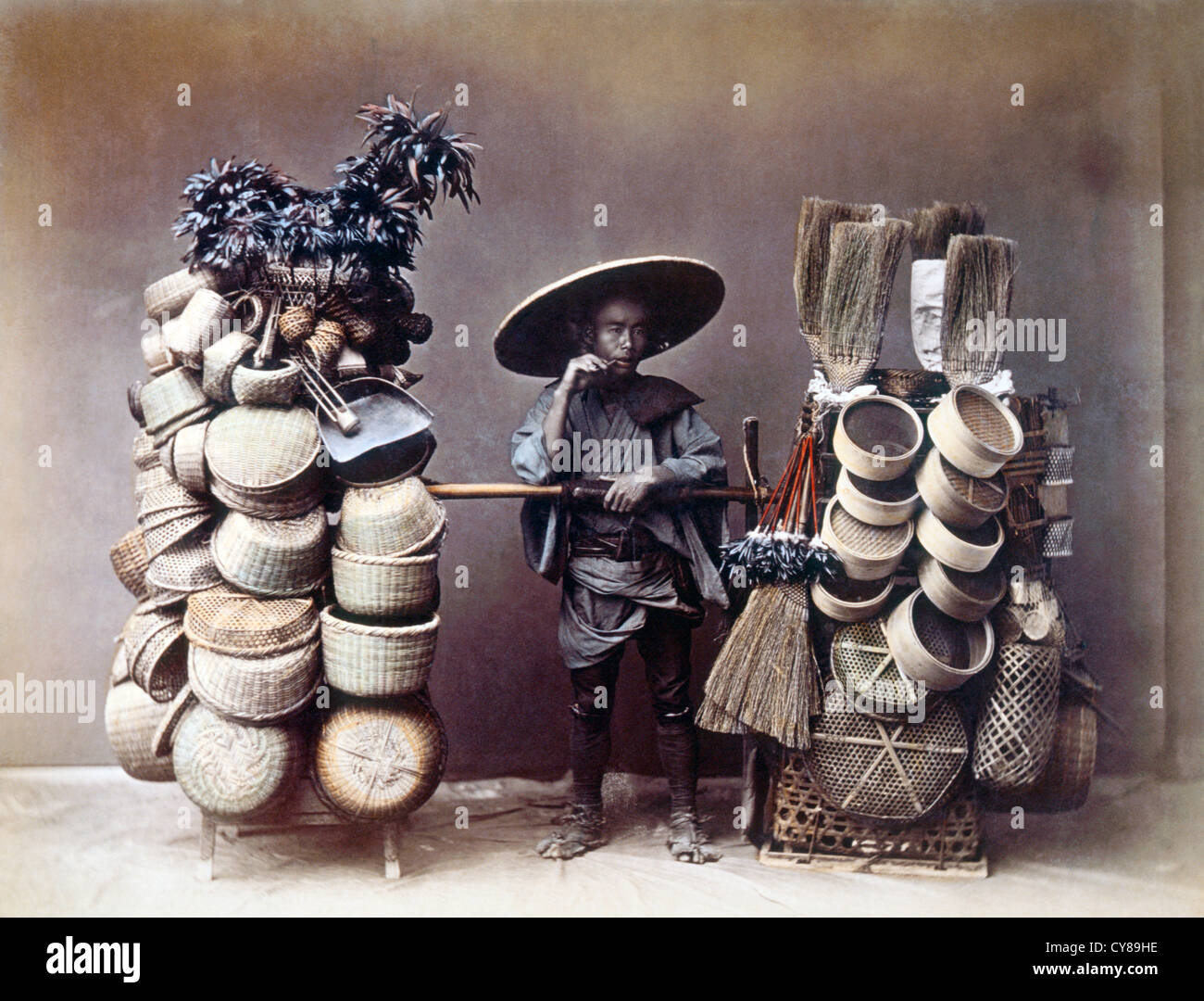 Japanese Man Selling Baskets, Hand-Colored Albumen Photograph, Circa 1870 Stock Photo