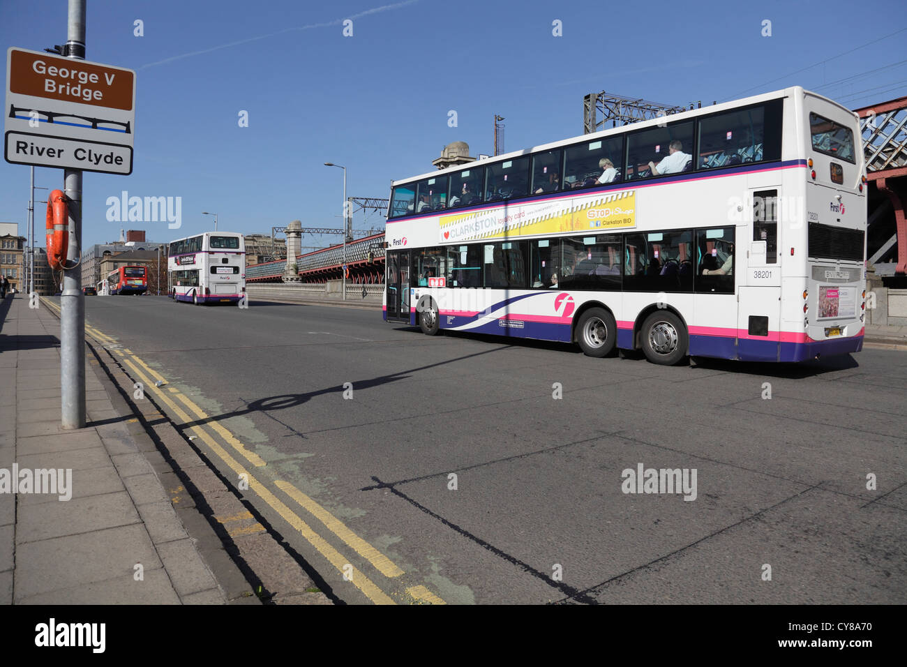 Looking North to buses crossing George V Bridge on Commerce Street over the River Clyde to Glasgow city centre, Scotland, UK Stock Photo