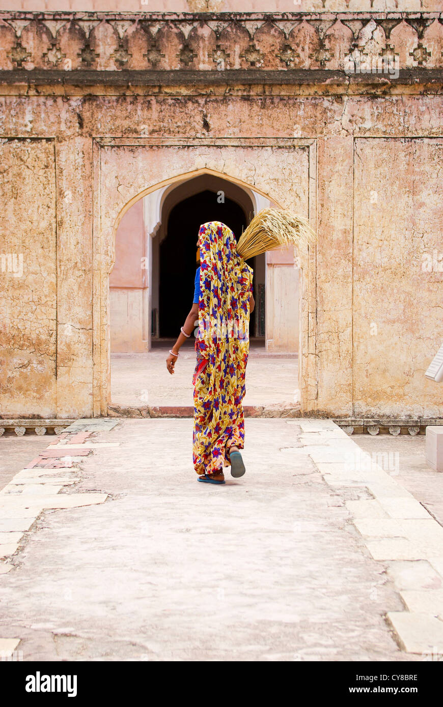 Local woman wearing bright clothes at the Palace of Man Singh I in Amer / Amber Fort near Jaipur, Rajasthan, India Stock Photo