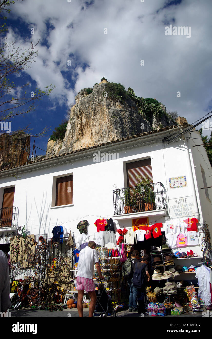 A tourist shop with castle behind at El Castell de Guadalest, Comunitat Valenciana, Spain Stock Photo