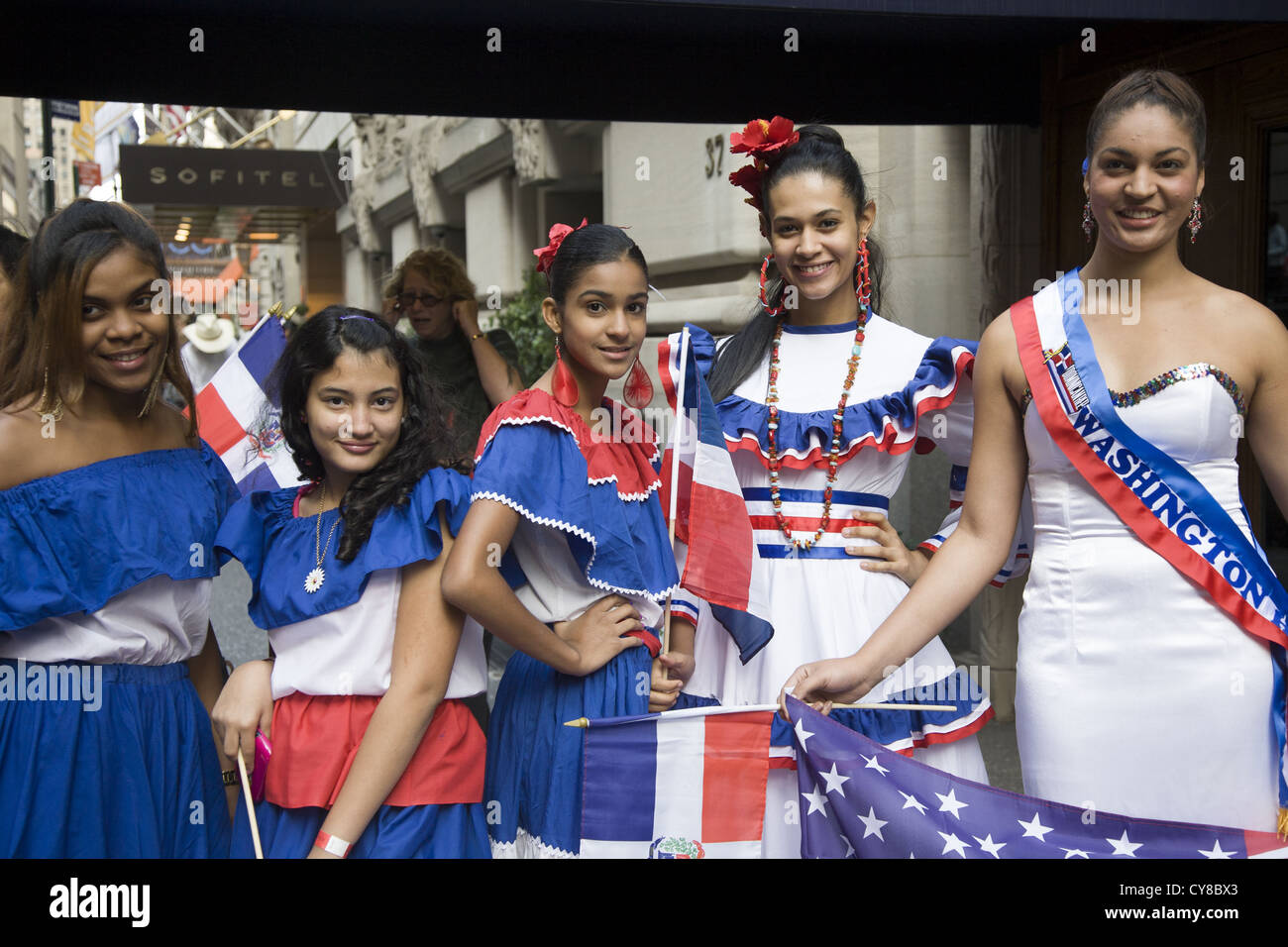Hispanic Day Parade, New York City. Young women represent  the Dominican Republic displaying their pride as Dominican Americans. Stock Photo