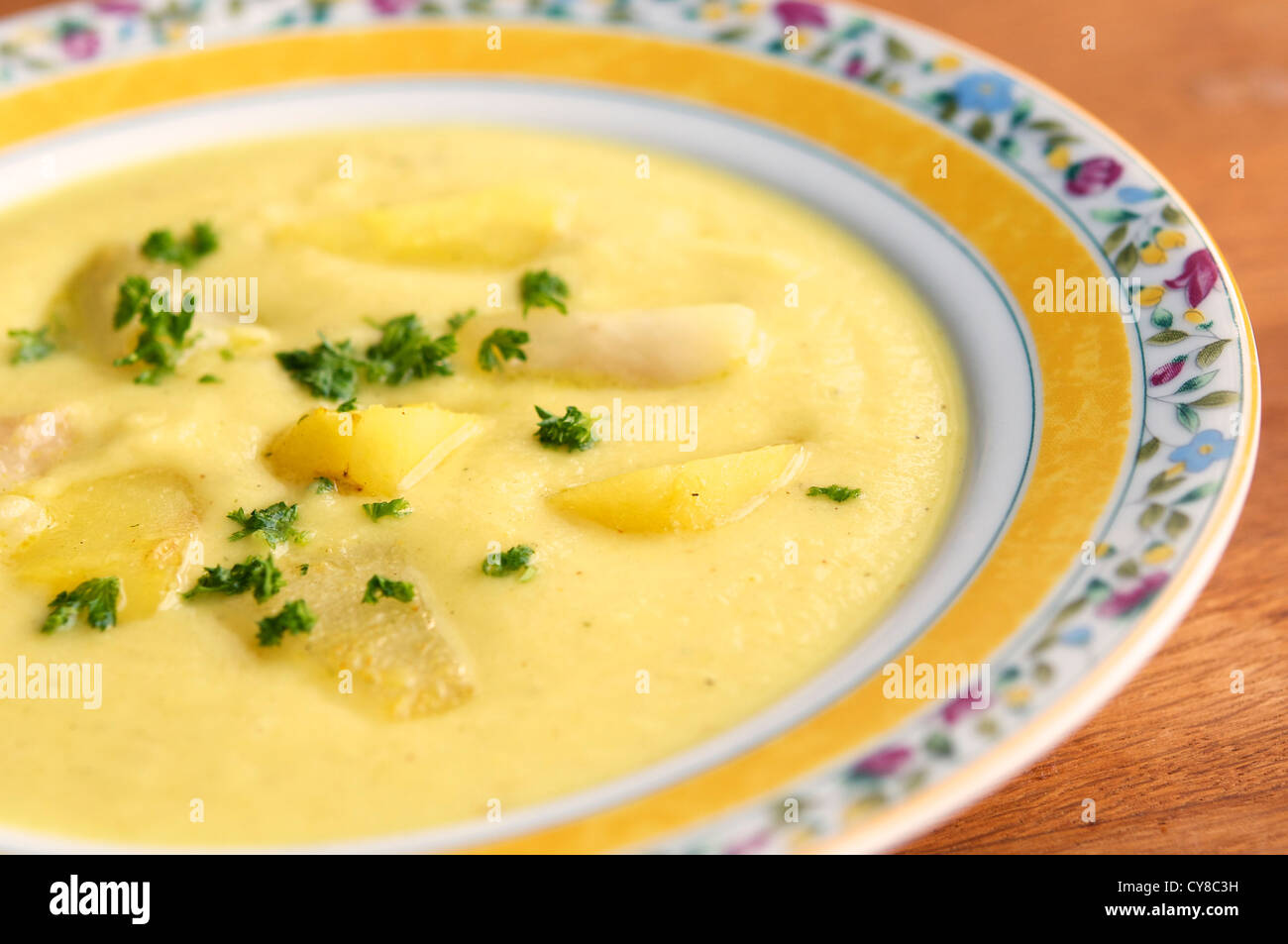 A lovely sweet and earthy pear and parsnip soup with a touch of curry. Stock Photo