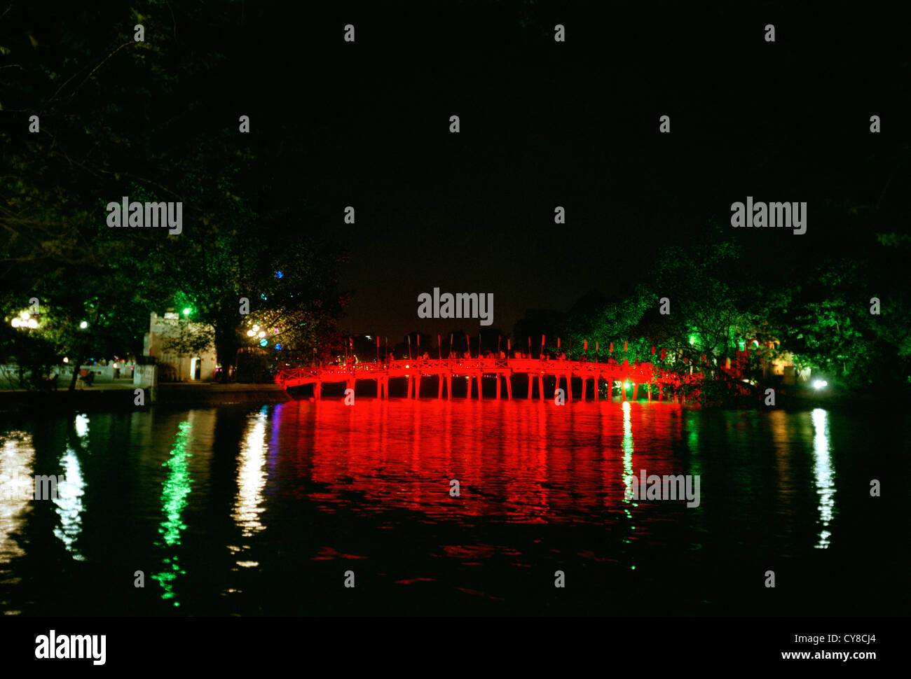 Huc Bridge at Hoan Kiem Lake in Hanoi in Vietnam in Far East Southeast Asia. Red Night Nightfall Dark History Surrealism Serenity Wanderlust Travel Stock Photo