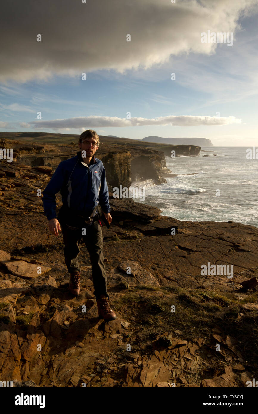 Walking along the coast at Yesnaby, Orkney islands Stock Photo