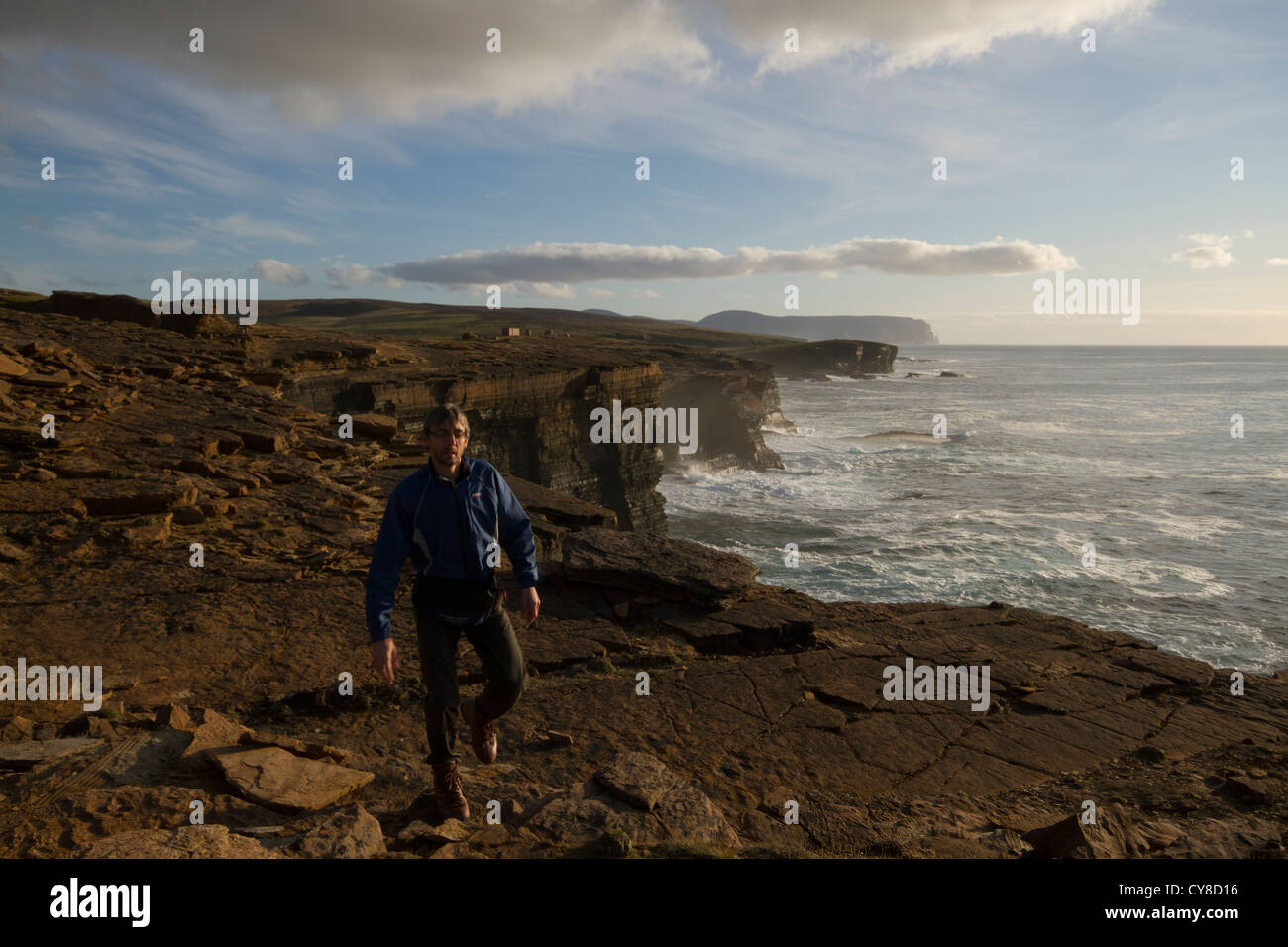 Hiking along the coast at Yesnaby, Orkney Islands Stock Photo
