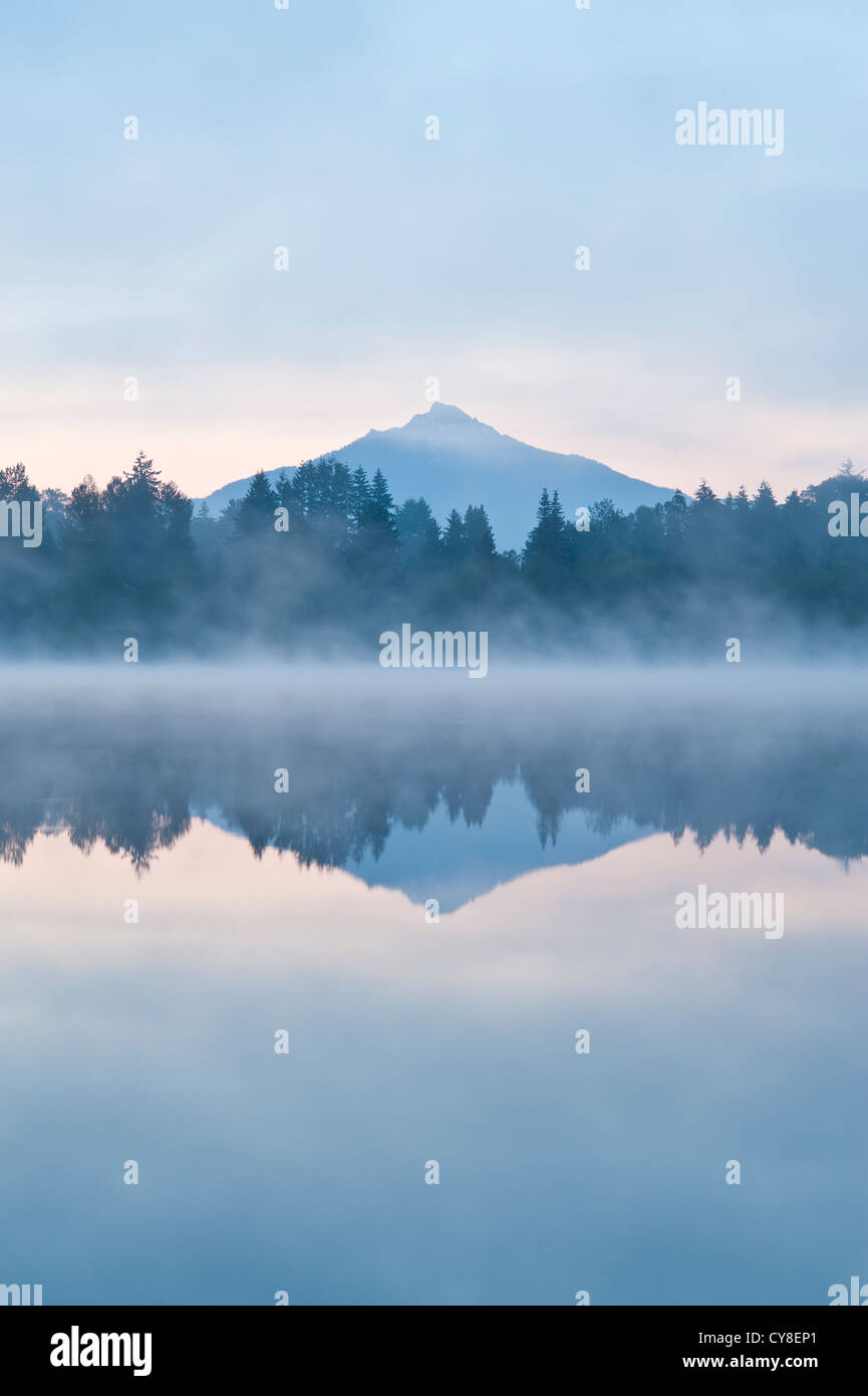 Sunrise in fog Lake Cassidy with Mount Pilchuck reflections Stock Photo