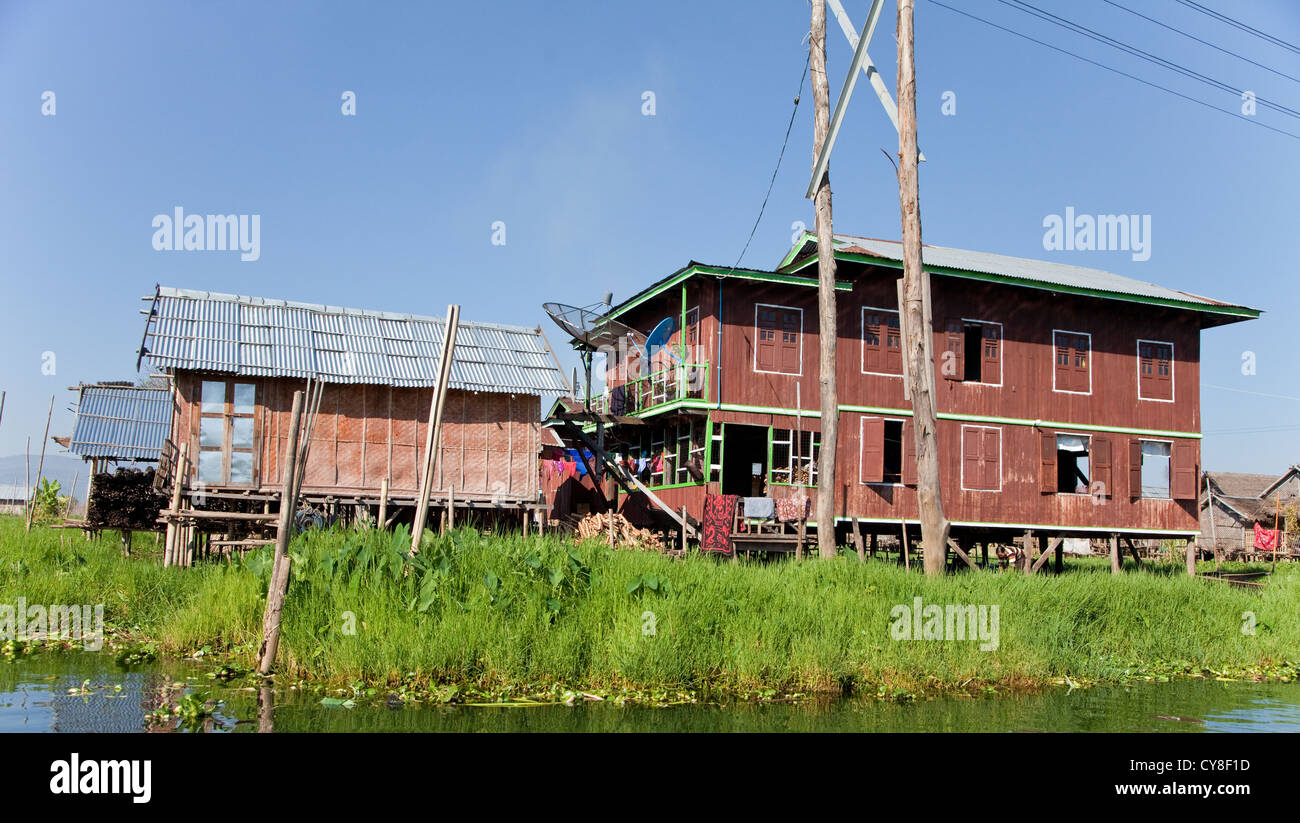 Myanmar, Burma. Houses on Stilts, with TV Satellite Dish, Inle Lake Village, Shan State. Stock Photo