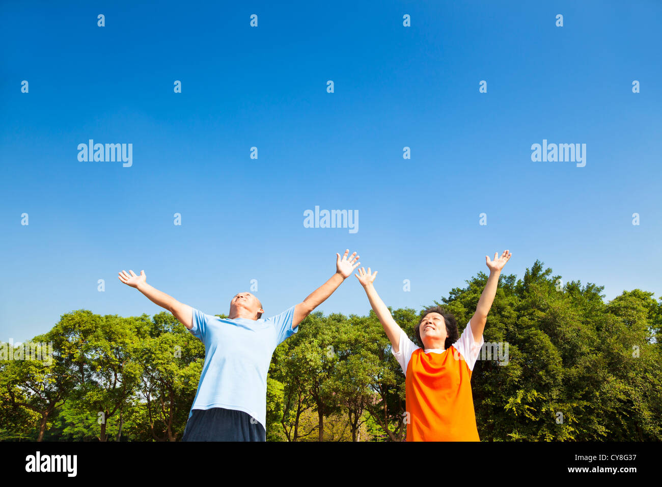 relaxed asian mature couple looking sky Stock Photo