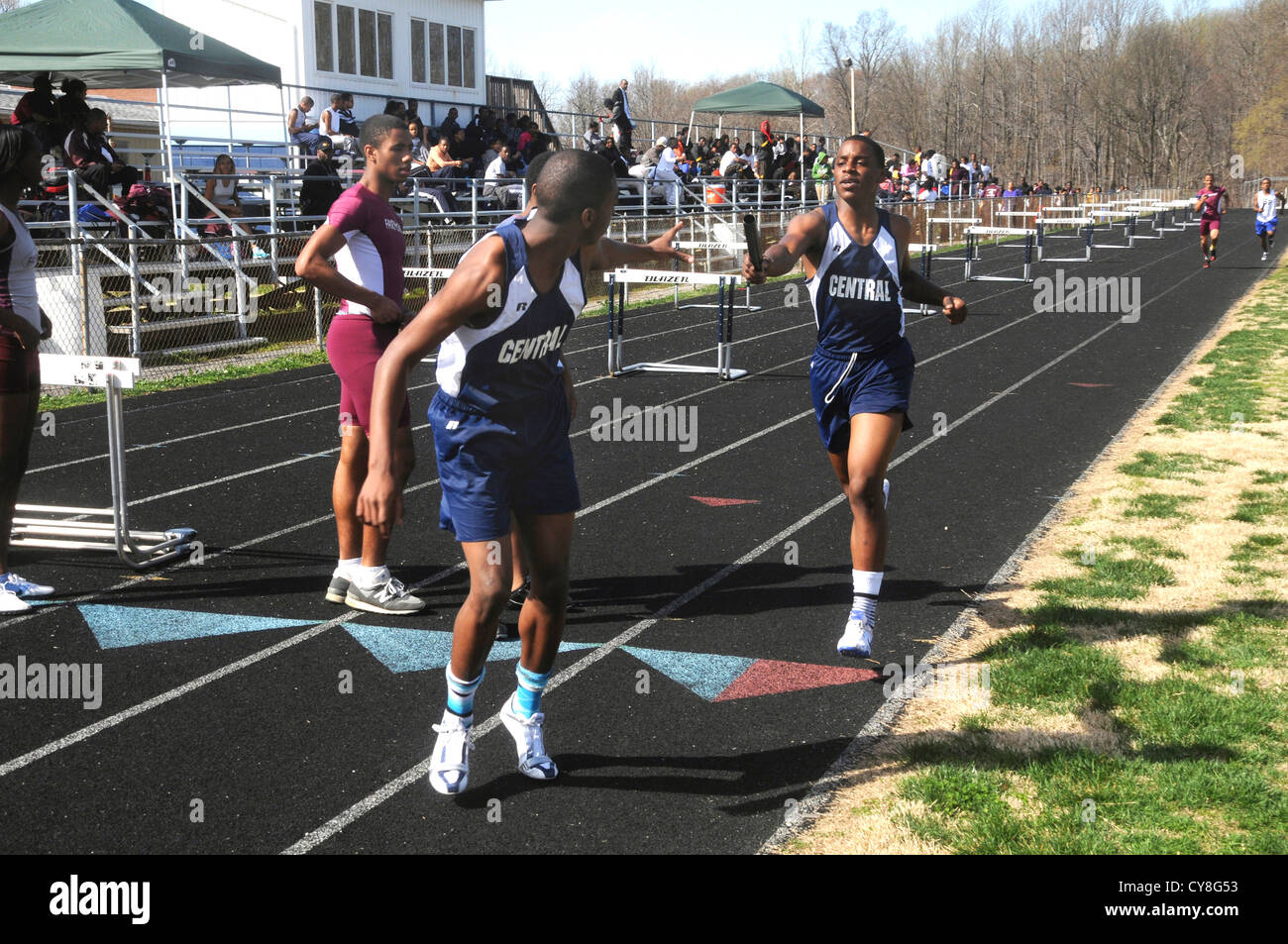 Boys relay race hand off in high school relay race in Seat Pleasant, Maryland Stock Photo