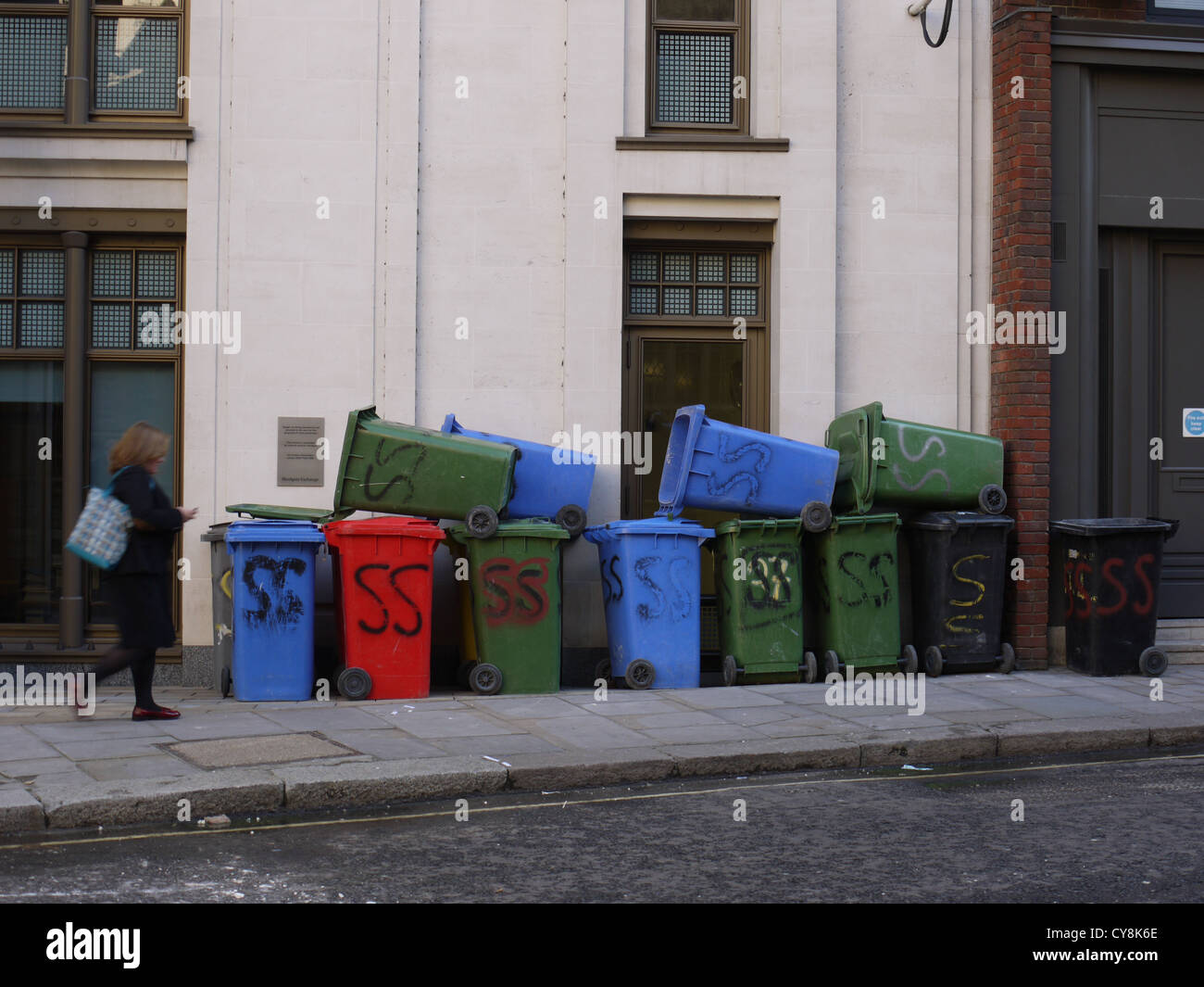 Wheelie bins refuse bins piled up outside central London office Stock Photo  - Alamy