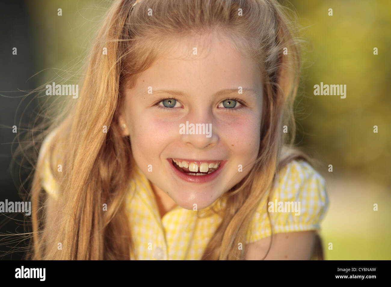 Young girl smiling at the camera Stock Photo - Alamy