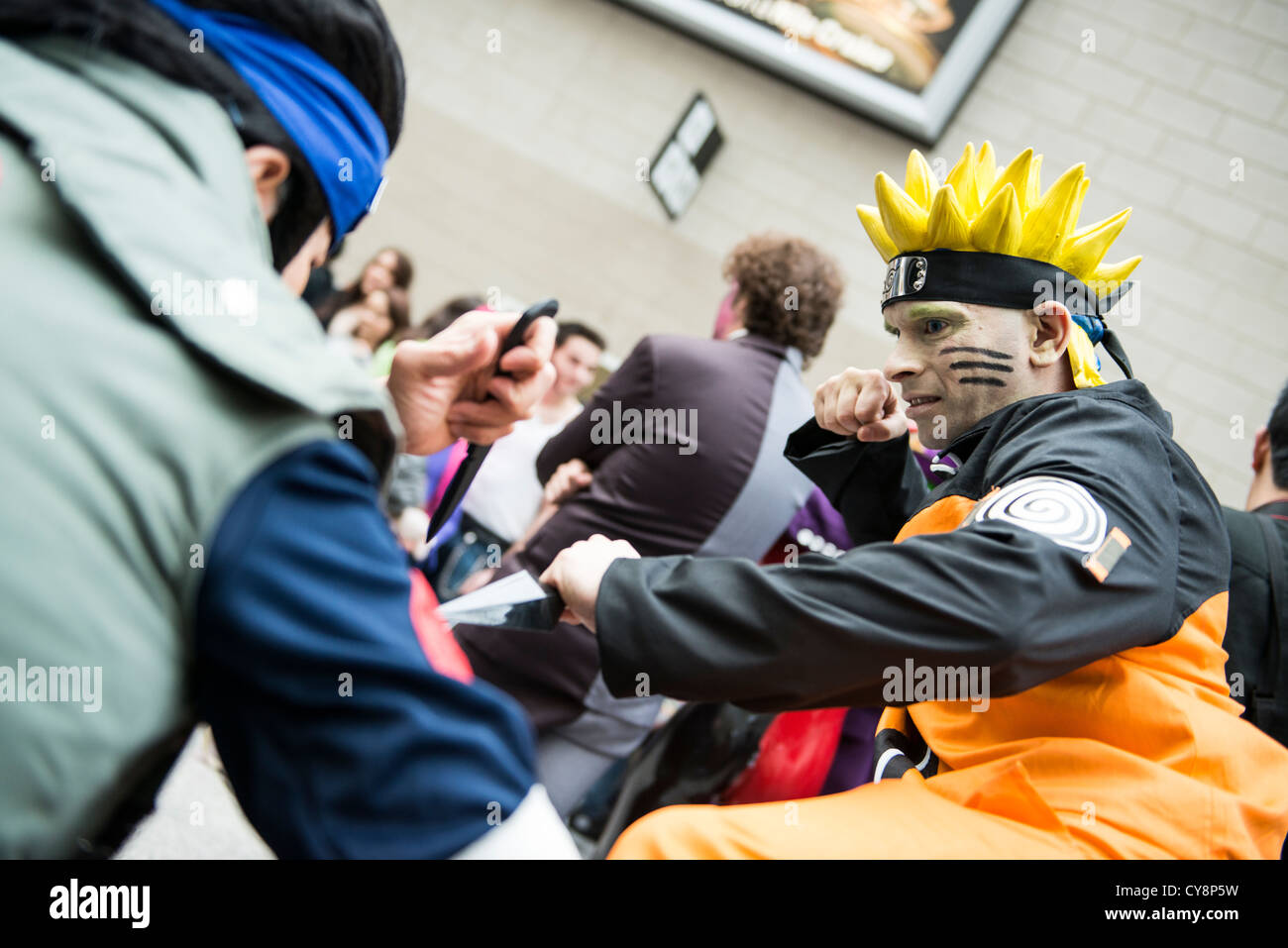LONDON, UK - OCTOBER 28: Cosplayers impersonating character Naruto pose for photographers at the London Comicon MCM Expo Stock Photo