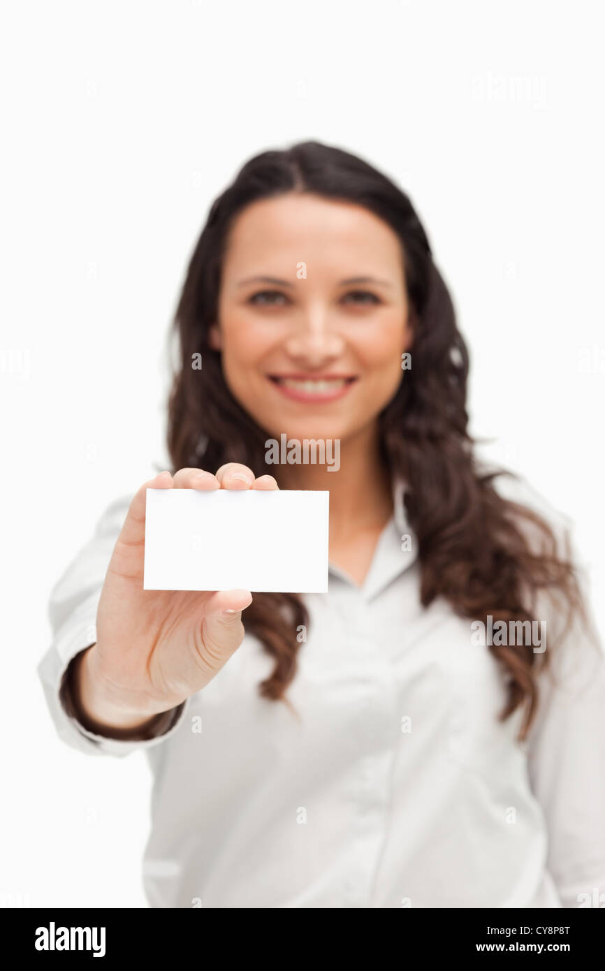 Brunette showing a card Stock Photo - Alamy