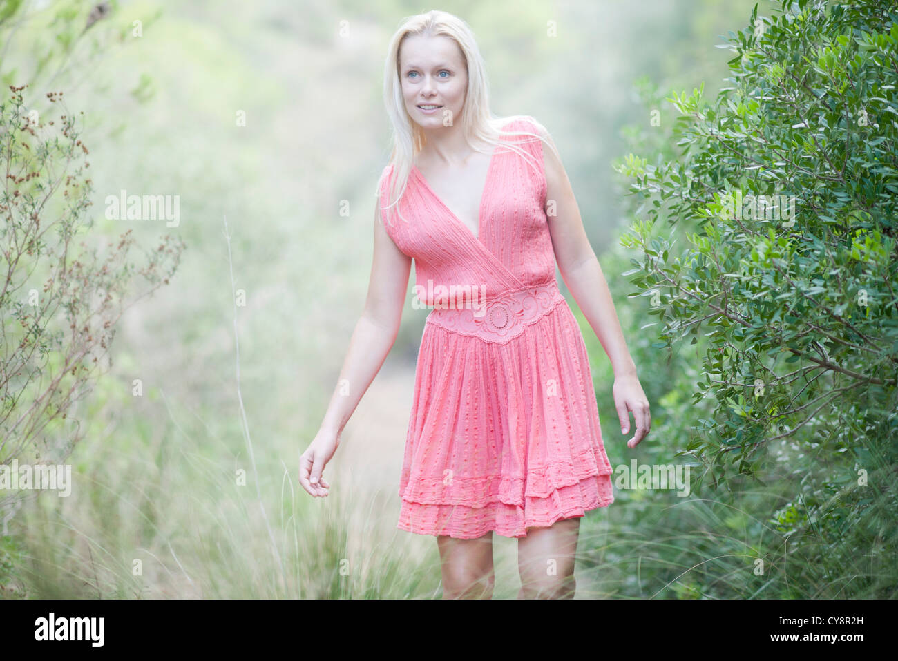 Young woman walking in nature Stock Photo - Alamy
