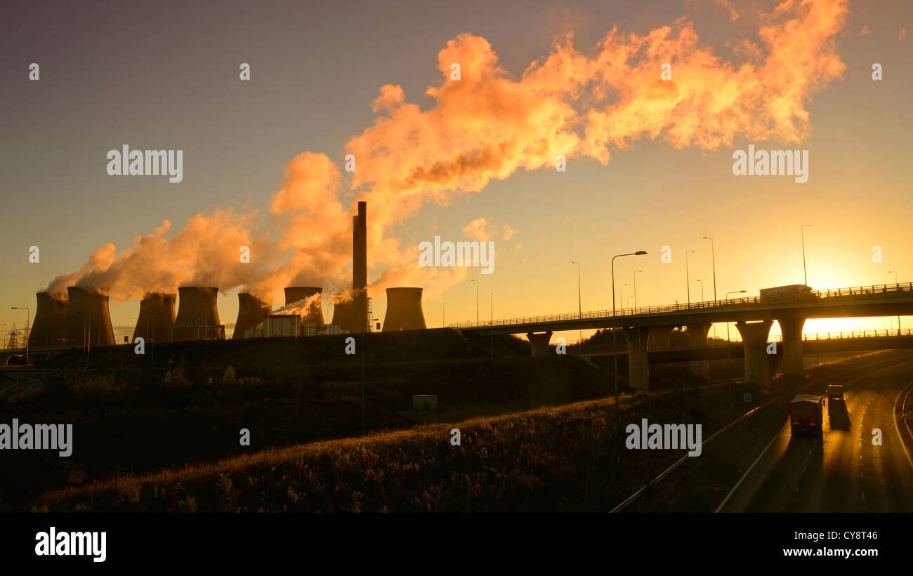Ferrybridge coal powered power station at sunrise by Holmfield junction linking the M1 and M62 motorways Yorkshire UK Stock Photo