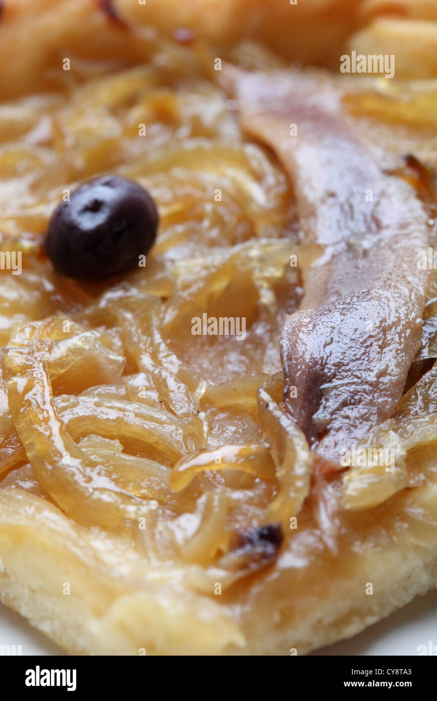 Slice of pissaladiere (onion tart) Stock Photo