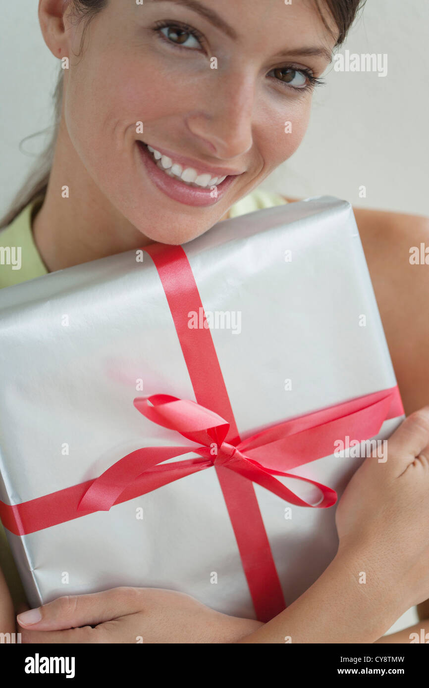 Young woman holding gift Stock Photo