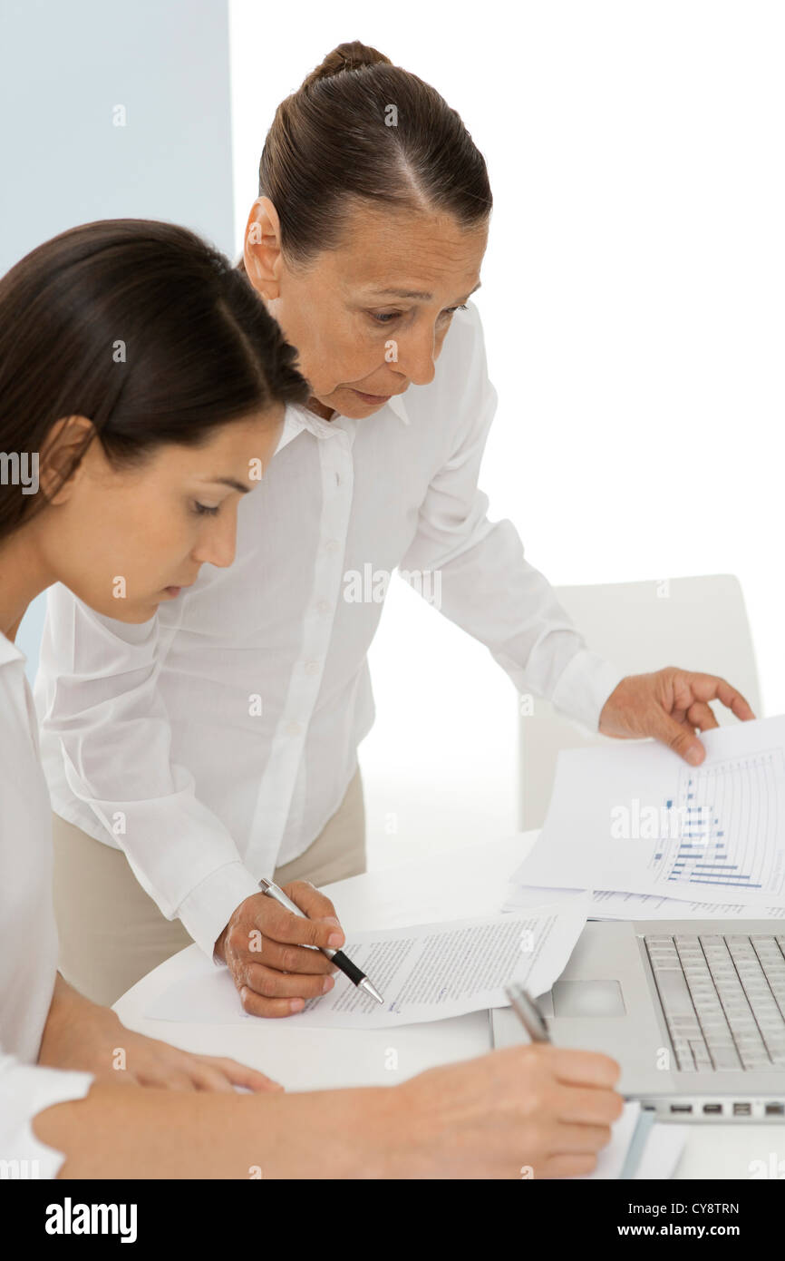 Colleagues discussing documents Stock Photo - Alamy