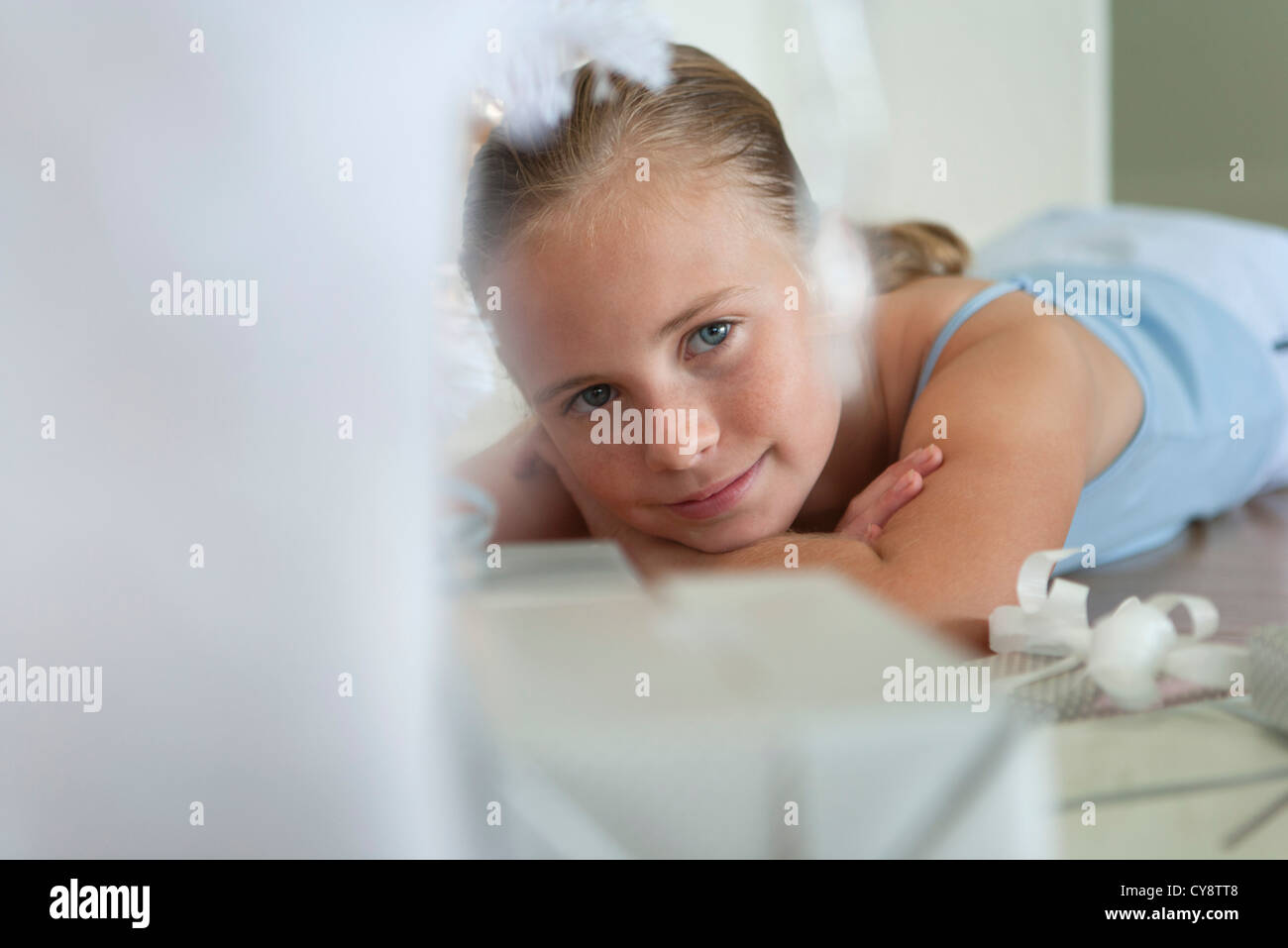 Preteen girl lying on stomach hi-res stock photography and images - Alamy