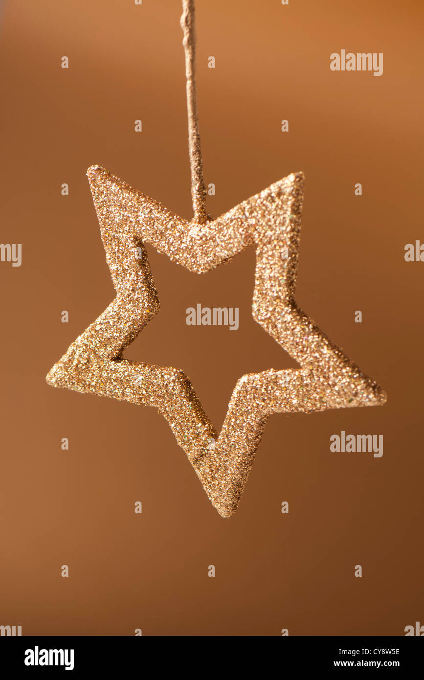 Golden star shaped Christmas ornament Stock Photo