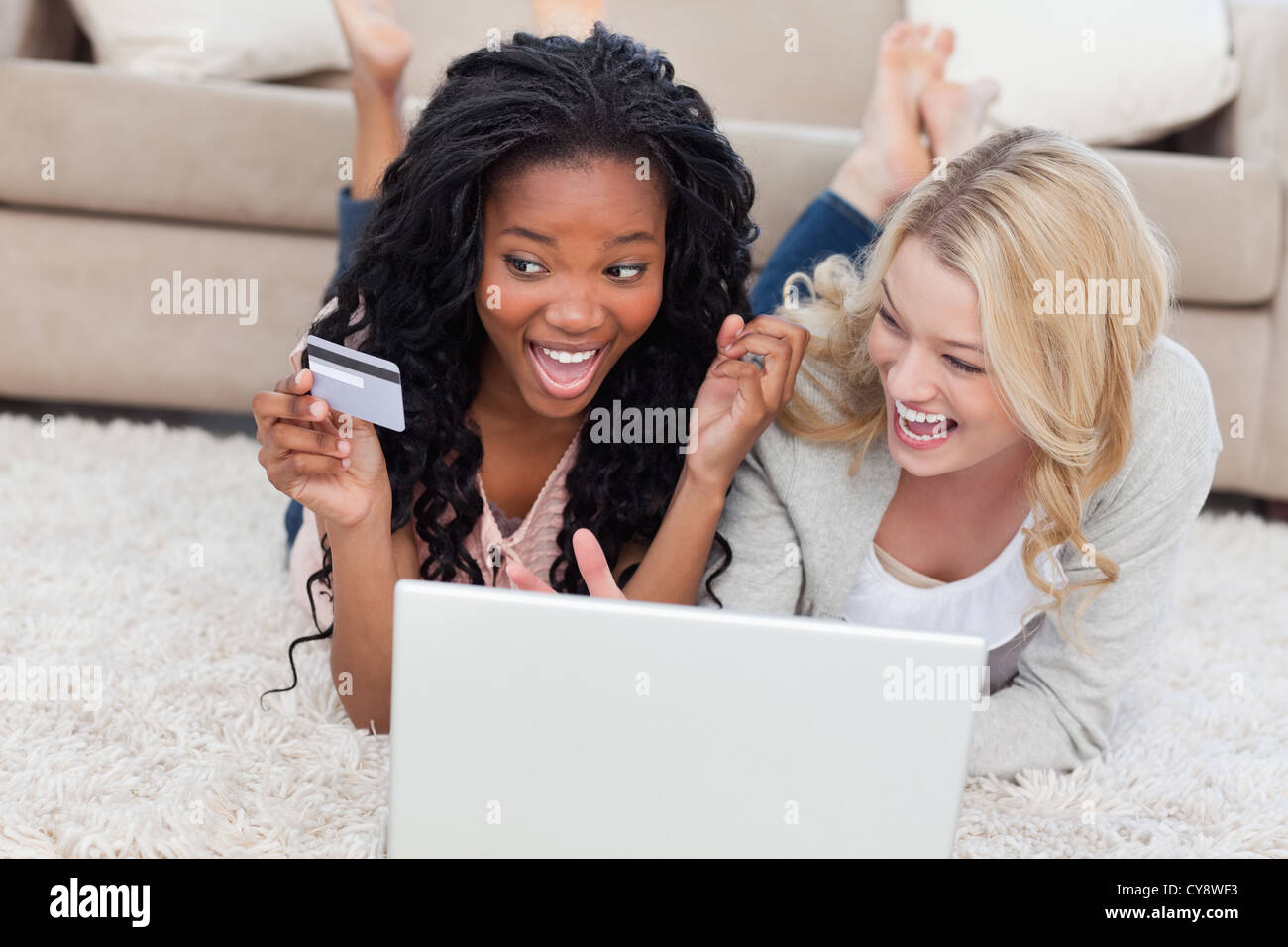 Women laughing indoors floor hi-res stock photography and images - Alamy