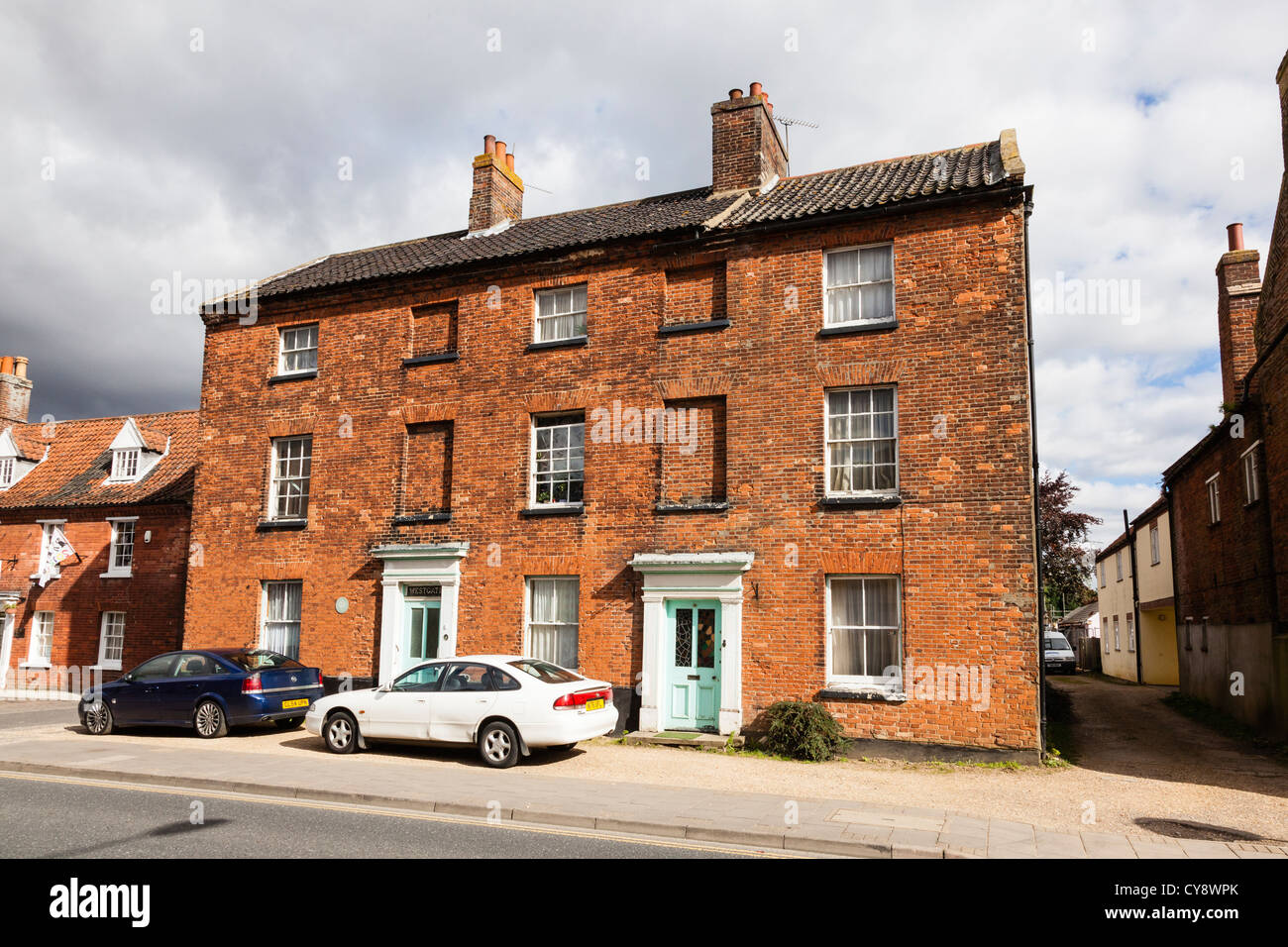 Large attractive red brick houses in the pretty market town of