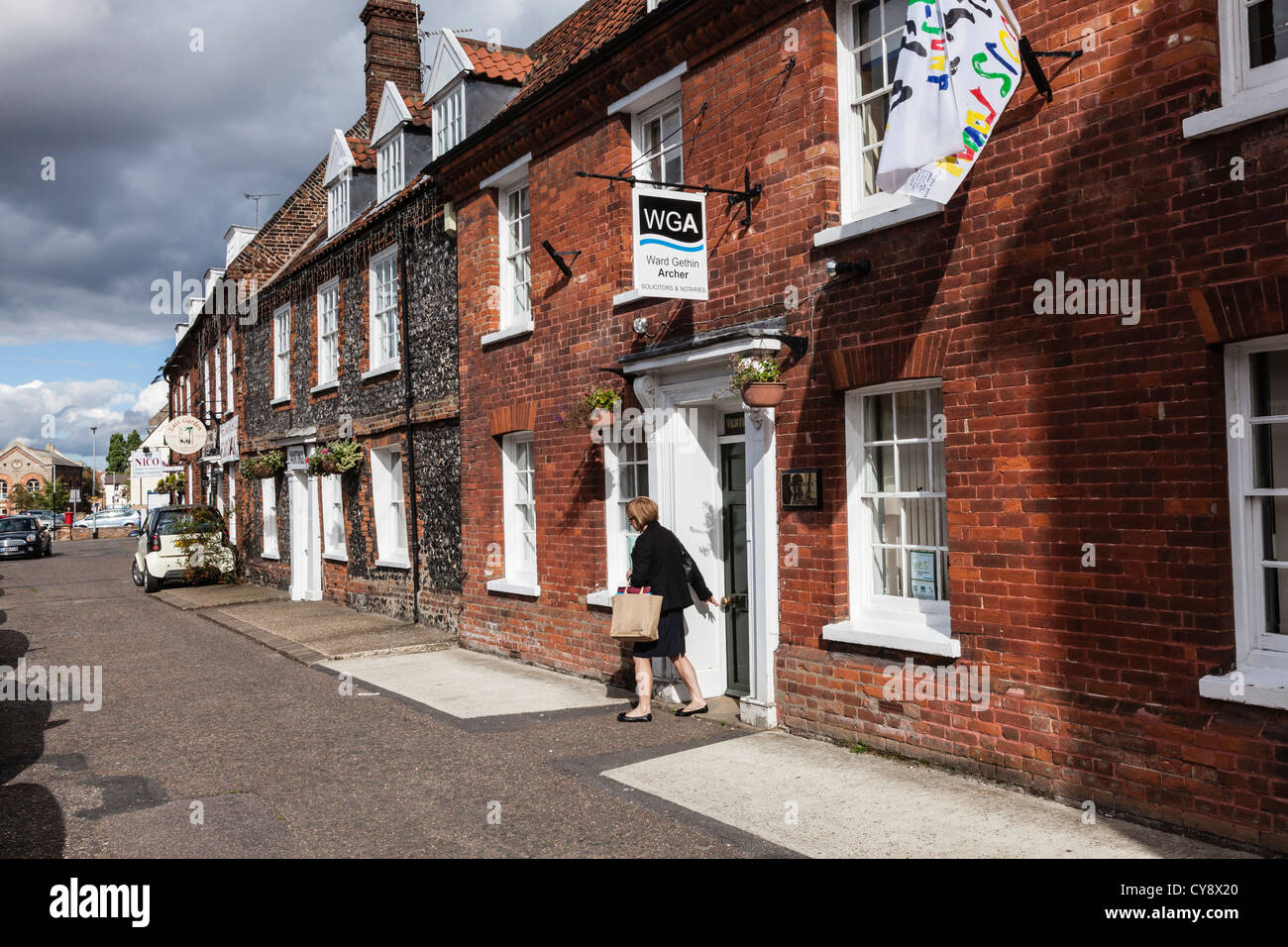 A woman leaves a Solicitors offices in the attractive market town of