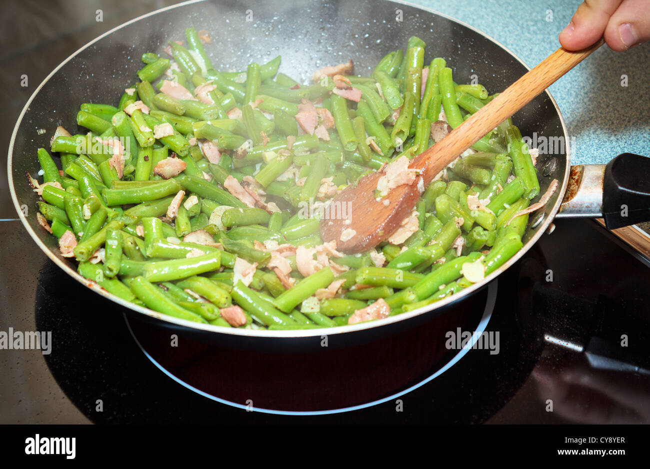 fried green beans with bacon and spices Stock Photo Alamy