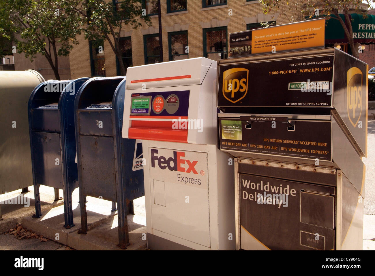 USA MADISON WISCONSIN US Mail, UPS, and Federal Express (FedEx) post boxes on the sidewalk. Stock Photo