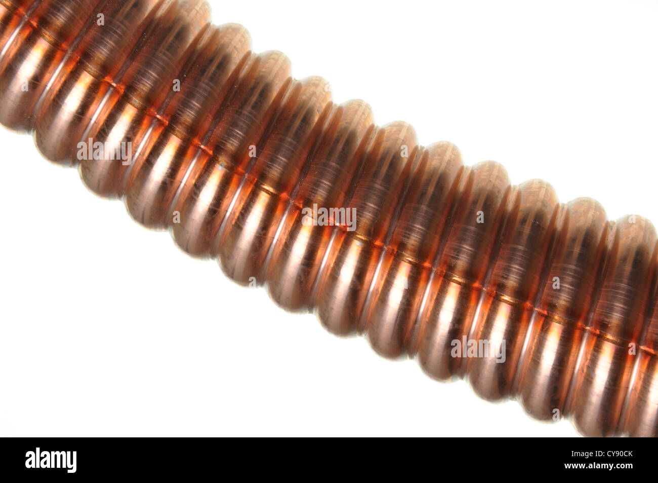 Corrugated copper tube on an isolated background Stock Photo