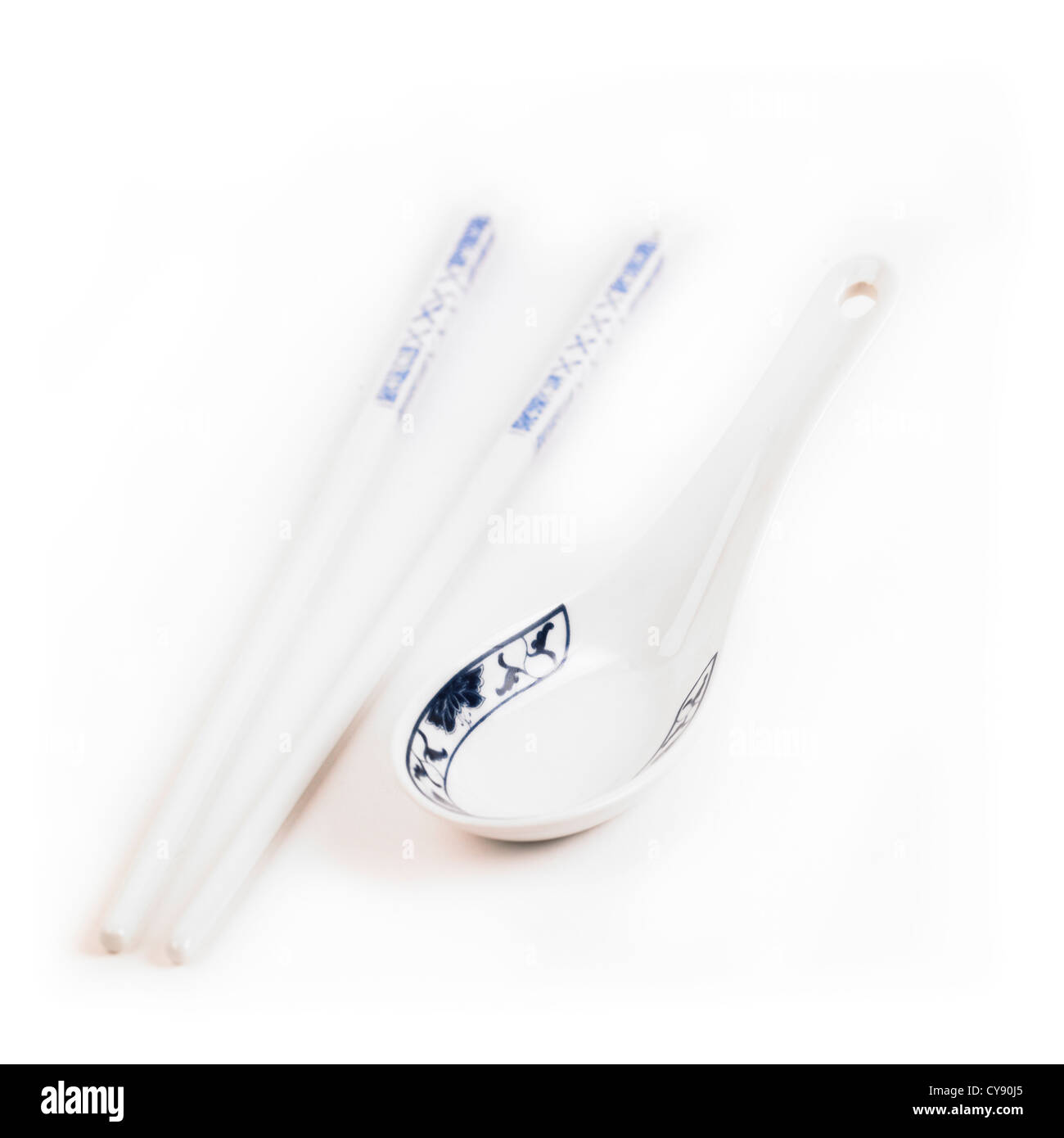 Chinese chopsticks and soup spoon on white background Stock Photo Alamy