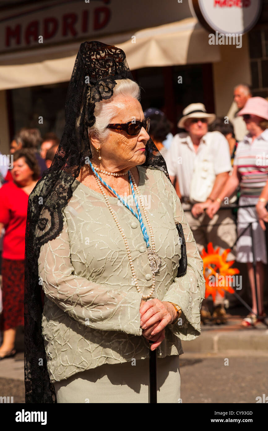 Senior Spanish lady wearing Mantilla. Religious Procession. Fuengirola