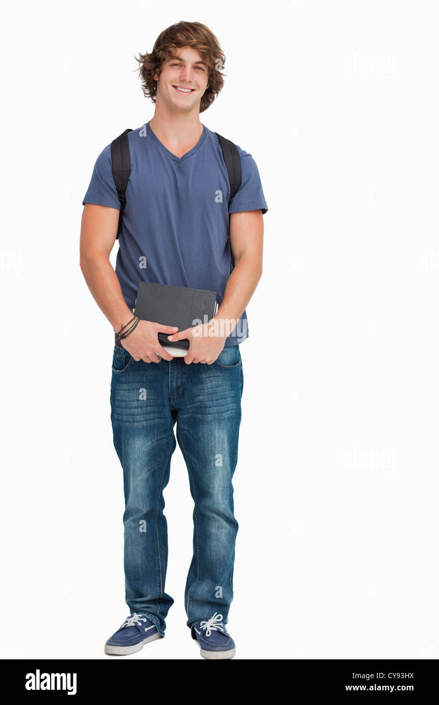 Male student posing with a backpack and books Stock Photo - Alamy