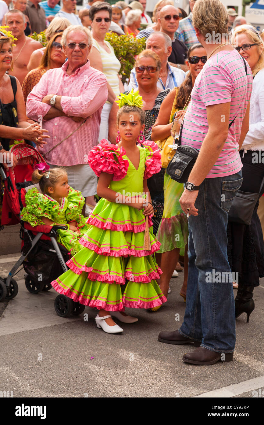 Children in Spanish dress watch Religious Procession. Fuengirola. Spain
