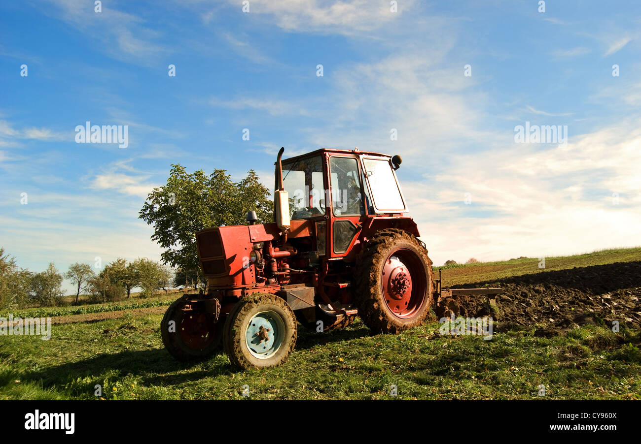 ploughing field on old tractor in Ukraine Stock Photo Alamy