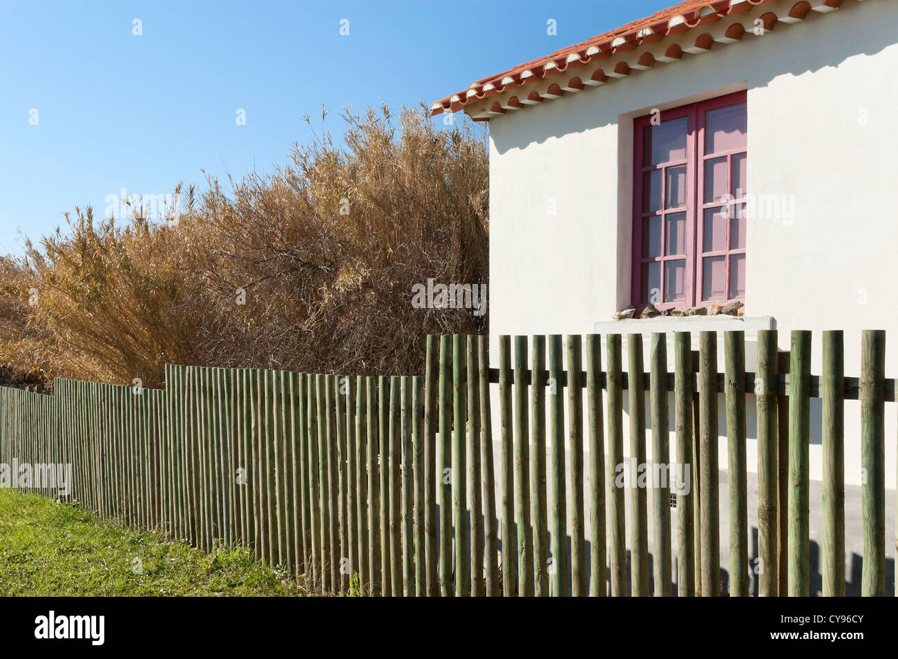 Wooden fence next a country house Stock Photo - Alamy
