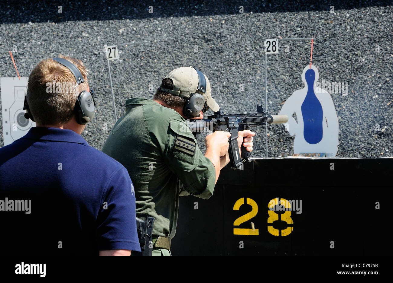 Gunman test firing automatic rifle at the FBI shooting range in Chicago