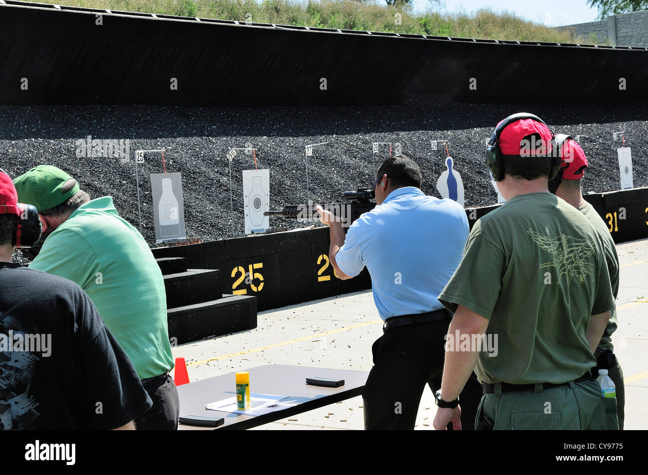Gunmen test firing automatic rifle at the FBI shooting range in Chicago