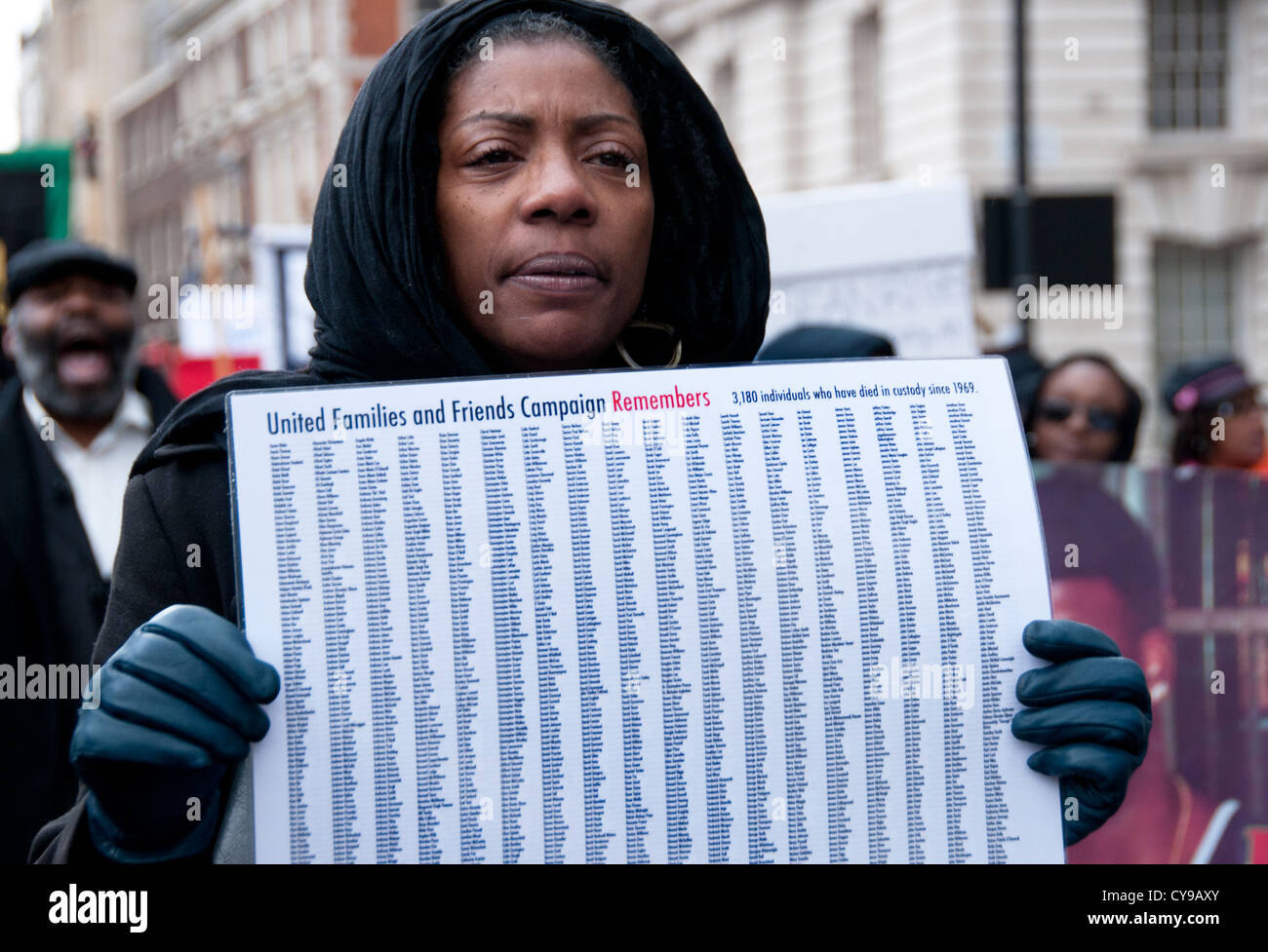 Marcia Rigg sister of Sean Rigg who died in custody 2008  holding names of those killed in police custody since 1969  2012 Londo Stock Photo