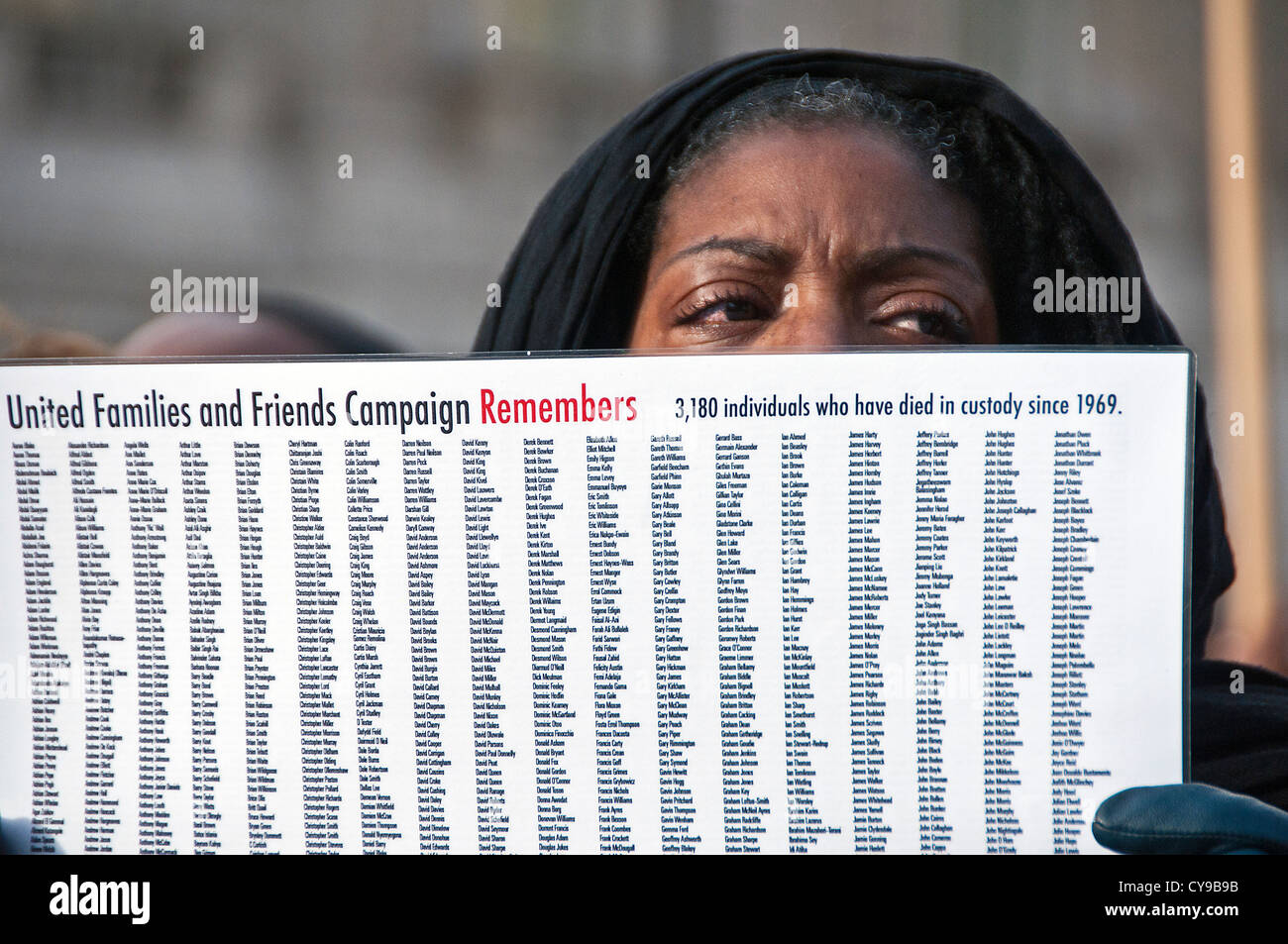 Marcia Rigg sister of Sean Rigg who died in custody 2008  holding names of those killed in police custody since 1969  2012 Londo Stock Photo