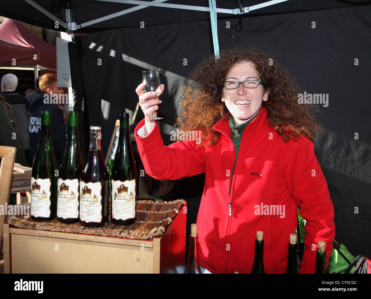 Woman holding wine glass Durham City food festival, north east England, UK Stock Photo