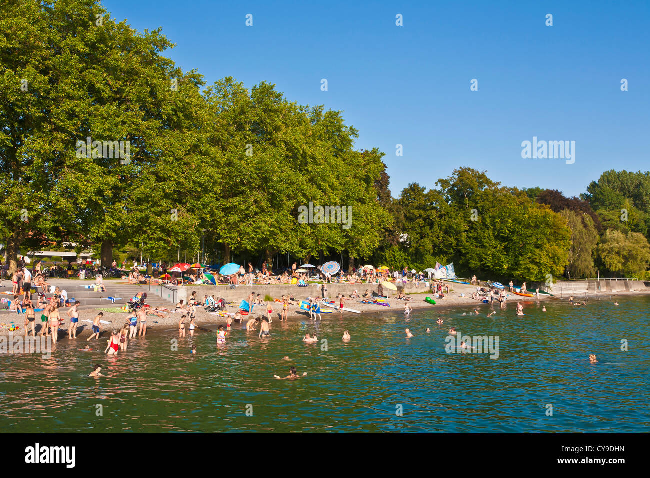 PEOPLE AT PUBLIC BATHING BEACH IN KRESSBRONN, LAKE CONSTANCE Stock