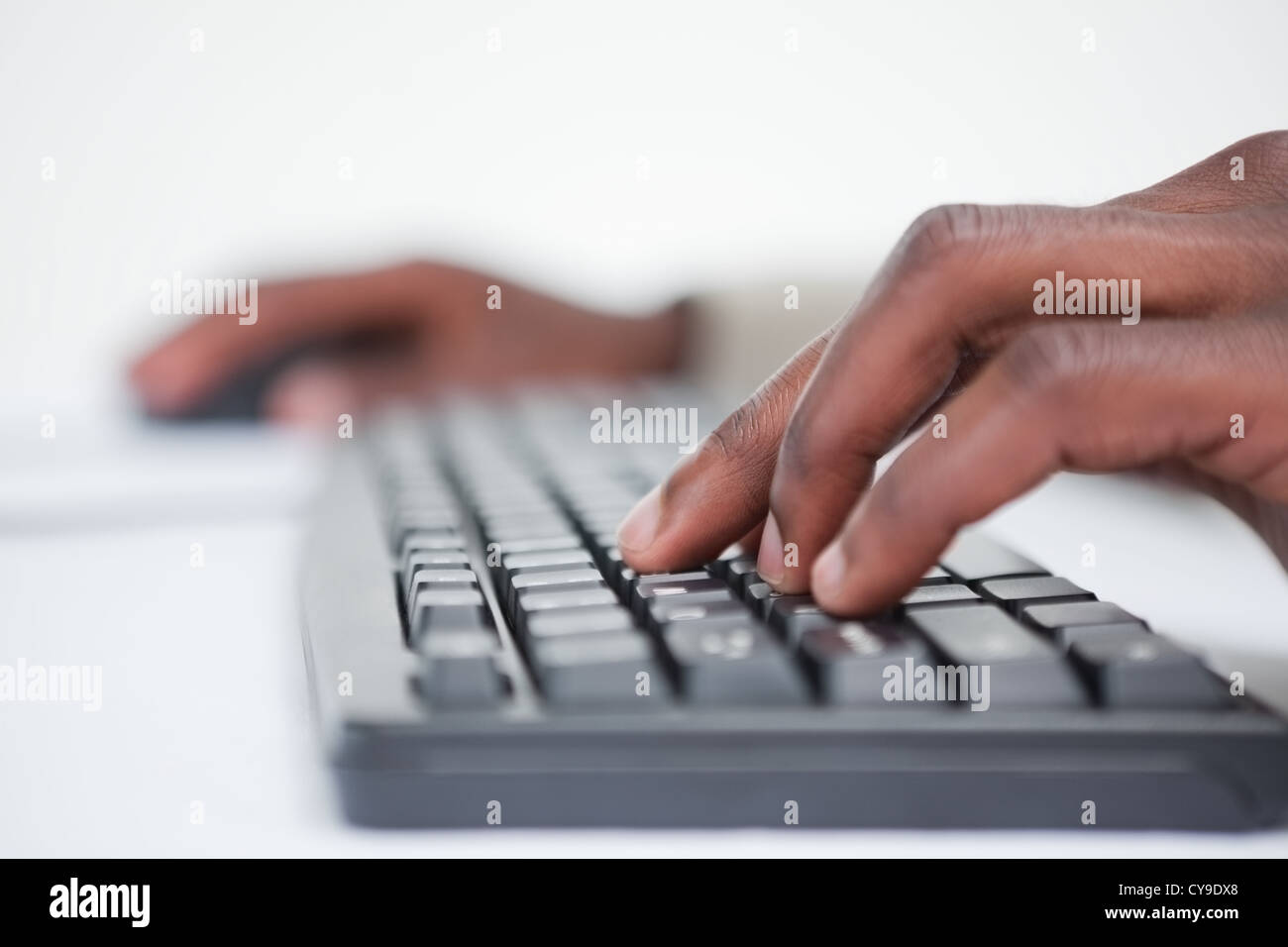 Close up of a masculine hand using a keyboard Stock Photo