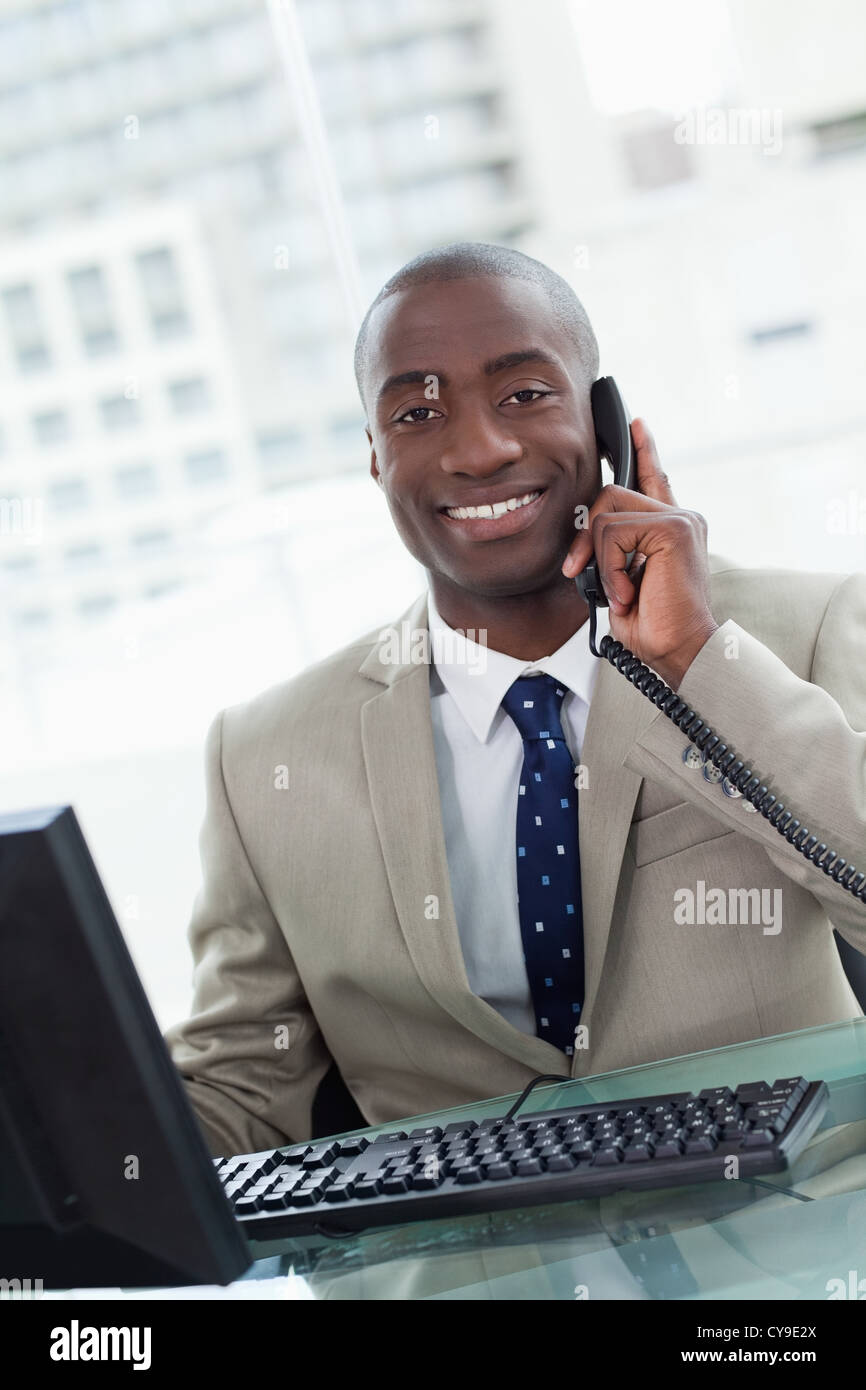 Handsome worker making call sitting hi-res stock photography and images ...