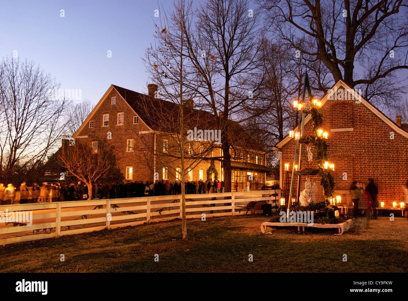 Traditional Moravian Christmas pyramid in Old Salem, North Carolina. Visitors are queuing for Candle Tea in the background. Stock Photo