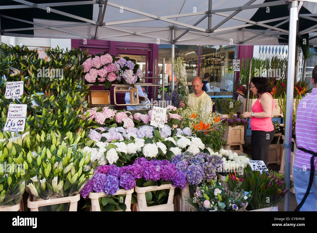 A stall holder in the popular London flower market in Columbia Road, London, England, GB, UK Stock Photo