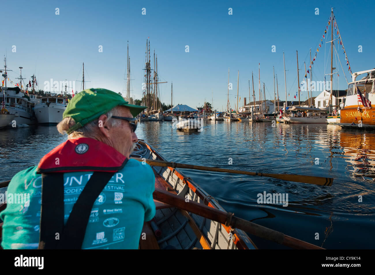 Taking a rowboat through the Port Townsend Wooden Boat Festival in Washington State, USA. Stock Photo