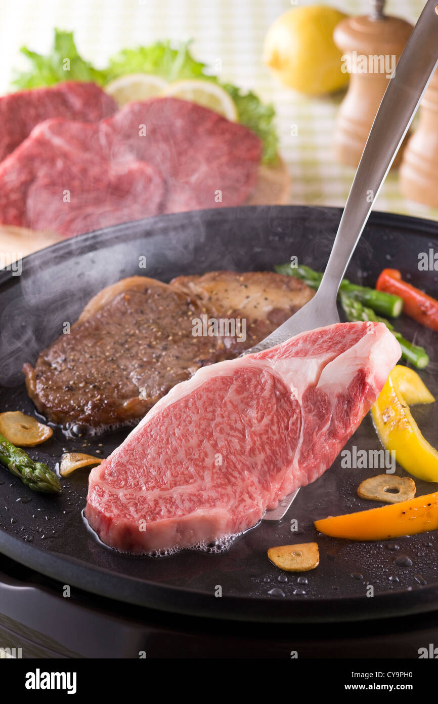Steak on Grill Plate Stock Photo Alamy