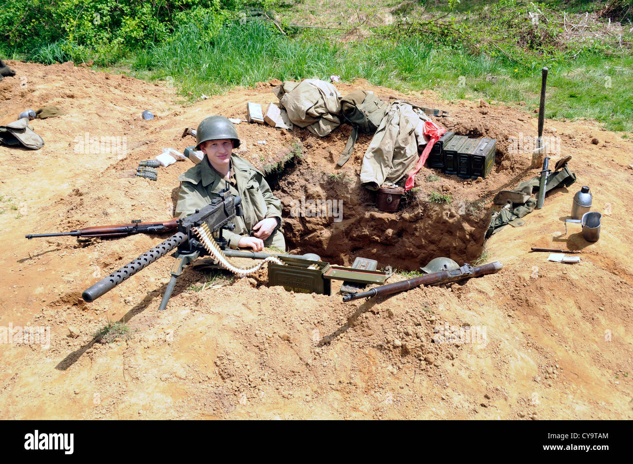 American Soldiers in a fox hole in a reenactment of WWII in Glendale, Maryland Stock Photo