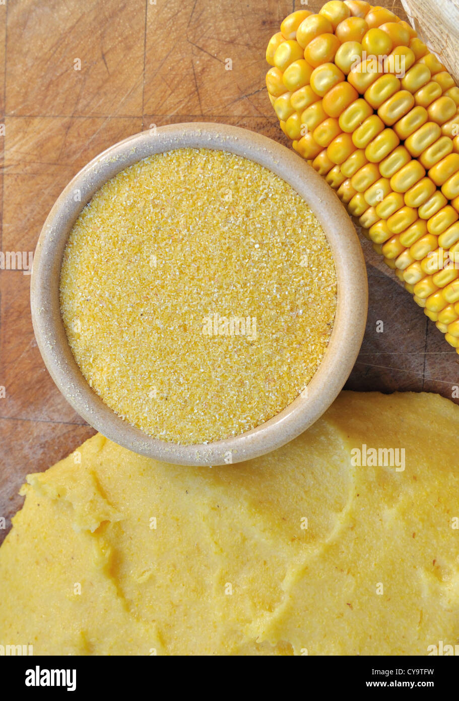bowl of corn flour on wooden board with polenta and ear of corn Stock Photo Alamy
